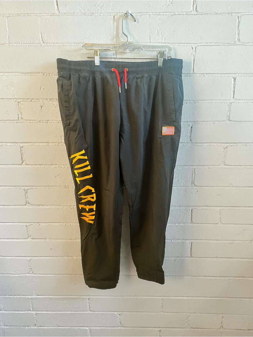 Kill Crew Black Joggers with Yellow Side Script and Red Drawcord